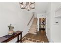 Hallway with view of staircase, chandelier and built in wine cellar at 18 Peachtree Ne Ave # 5, Atlanta, GA 30305