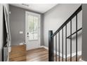 Inviting foyer with hardwood floors, gray walls, and a stylish mirror accent at 3484 Orchard St, Atlanta, GA 30354