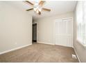 Comfortable bedroom with ceiling fan and closet space at 6194 Golden Meadow Court Ct, Riverdale, GA 30296
