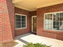 Inviting brick home entry with large windows and a covered porch at 120 Chastain Nw Rd # 1803, Kennesaw, GA 30144
