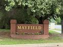 Mayfield neighborhood brick sign with gold lettering and manicured flower bed at 1438 Salem Dr, Alpharetta, GA 30009