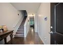 Inviting entryway with hardwood floors and a staircase leading to the upper level of the home at 3155 Tarian Way, Decatur, GA 30034