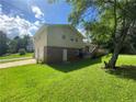 Backyard exterior of home featuring a two car garage and a wooden deck at 5114 Rock Eagle Dr, Stone Mountain, GA 30083