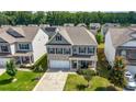 An aerial view showcasing the home's location in a peaceful neighborhood with mature trees at 1570 Ribbon Mill Sw Ln, Mableton, GA 30126