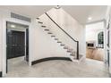 Hallway with stairs and doorways leading to living room with fireplace at 650 Moores Mill Nw Rd # 1, Atlanta, GA 30327
