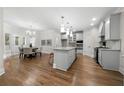 Modern kitchen with stainless steel appliances, a central island, and an adjacent dining area at 4544 Cavallon Nw Way, Acworth, GA 30101