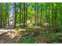 A charming two-story home is nestled amongst mature trees offering privacy and a connection with nature at 70 Juliana Dr, Ellenwood, GA 30294