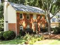 Charming brick home with a well-manicured lawn and inviting front entrance at 10815 Tuxford Dr, Alpharetta, GA 30022