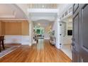Inviting foyer with hardwood floors, wainscoting, and a view into the living spaces at 4310 Granby Way, Marietta, GA 30062