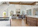 Open living room with high ceilings, fireplace, and large windows at 113 Laurel Brook Ln, Canton, GA 30115