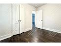 Bright bedroom with closet doors and dark wood floors, ready for customization at 1914 North Nw Ave, Atlanta, GA 30318