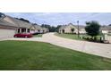 Serene street view showcasing well-manicured lawns and beautiful single-story homes at 245 Fenwick Cir, Mcdonough, GA 30253