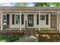 Inviting front porch featuring stylish columns, a brick base, and a welcoming entryway at 2826 Summit Ridge Dr, Marietta, GA 30066