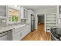 Updated kitchen featuring granite countertops, stainless steel appliances, and hardwood floors at 2826 Summit Ridge Dr, Marietta, GA 30066