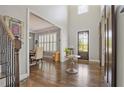 Elegant foyer features hardwood floors, high ceilings, staircase, and views into the living spaces at 2380 Tayside Nw Xing, Kennesaw, GA 30152