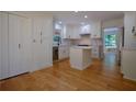 Newly remodeled kitchen boasting white cabinets, a center island, and stainless steel appliances at 260 Lakemont Dr, Roswell, GA 30075
