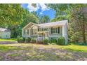 Charming two-story home featuring a welcoming front porch and well-maintained lawn at 113 Hitchcock Dr, Villa Rica, GA 30180