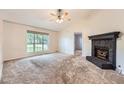 Comfortable living room with a stone fireplace and vaulted ceilings at 113 Hitchcock Dr, Villa Rica, GA 30180