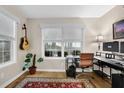 Well-lit home office with two windows, and contemporary desk setup, ideal for productivity at 4081 Riverlook Se Pkwy # 13, Marietta, GA 30067