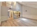 Bright living room with vaulted ceilings, modern floors, and an open concept design at 440 Forestgate Ct, Atlanta, GA 30350
