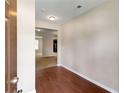 Entryway features wood-look flooring and a view into other rooms at 1212 Ithaca Dr, Mcdonough, GA 30253