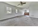 Living room with carpet and access to an exterior door and kitchenette at 14367 Fincher Rd, Canton, GA 30114