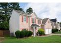 Brick home featuring well-maintained landscaping and a two-car garage, situated in a residential area at 1137 Misty Valley Ct, Lawrenceville, GA 30045