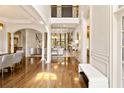 Bright foyer with hardwood floors, grand staircase, and high ceilings, leading into other living spaces at 2230 Cambridge Hill Ct, Dacula, GA 30019