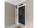 Charming front door with black paint, white trim, and a decorative wreath at 603 Brighton Pt, Atlanta, GA 30328