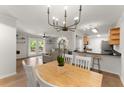 Open-concept living space with hardwood floors, bright lighting, and modern kitchen at 603 Brighton Pt, Atlanta, GA 30328