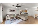 Inviting living space featuring plush sofas, hardwood floors, and direct access to kitchen at 603 Brighton Pt, Atlanta, GA 30328