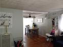 Inviting dining area with hardwood floors, ample natural light, and a ceiling fan at 649 Mary Ln, Marietta, GA 30062