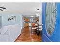 A view into a light blue living room featuring hardwood floors and contemporary decor at 1694 Pheasant Dr, Atlanta, GA 30238