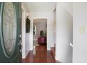Welcoming entryway with hardwood floors, a decorative door, and access to the upper level at 3359 Villa Ln, Douglasville, GA 30135