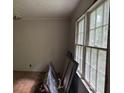 Bedroom awaiting transformation, featuring large windows for natural light at 372 Nalley Dr, Stone Mountain, GA 30087