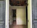 Entryway showcases an opportunity for renovation, leading to the bath and other rooms at 372 Nalley Dr, Stone Mountain, GA 30087