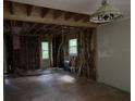 Living room under renovation, showcasing exposed framing and hardwood floors at 372 Nalley Dr, Stone Mountain, GA 30087