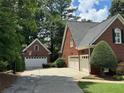 Attached and detached garages for plenty of parking space at 1464 Chatsworth Trace, Lawrenceville, GA 30044