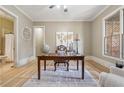 Bright office space featuring hardwood floors, large windows, and adjoining bath at 3405 Camellia Ln, Suwanee, GA 30024