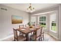 Inviting dining room bathed in natural light from expansive windows, ideal for enjoying meals with Gathering at 350 Dailey Mill Rd, Mcdonough, GA 30253