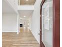 Bright entryway showcasing light wood floors and an open floor plan with views to the living spaces at 3623 Squires Park Ln, Loganville, GA 30052