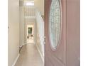 Bright entryway featuring tile flooring and staircase to the upper level at 300 Twin Tendrils Sw, Atlanta, GA 30331