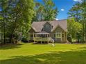 Inviting backyard featuring a well-maintained lawn and deck with gazebo at 507 Wintergreen Way, Canton, GA 30115