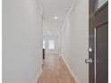 Bright entryway with light wood flooring and a clear view into the living space at 913 Agate Ln, Lawrenceville, GA 30043