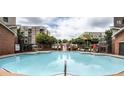 Large community pool with seating and attractive landscaping at 898 Oak St Sw # 1215, Atlanta, GA 30310
