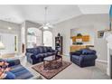 Cozy living room with plush furnishings, neutral carpet, and arched openings, leading to other areas of the home at 1530 Brisbane Dr, Dacula, GA 30019