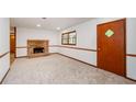 Cozy basement with a brick fireplace and neutral carpet, perfect for entertaining at 2923 Bicentennial Dr, Stone Mountain, GA 30087