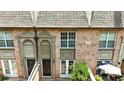 Overhead view of brick townhouses showing rooflines, patios, and covered entries at 6980 Roswell Rd # P6, Atlanta, GA 30328