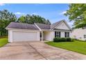 Inviting home with attached garage, neat landscaping, and classic white siding at 102 Natalie Ct, Dallas, GA 30157