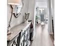 Bright hallway leads to an open living space with city views at 3338 Peachtree Ne Rd # 1507, Atlanta, GA 30326